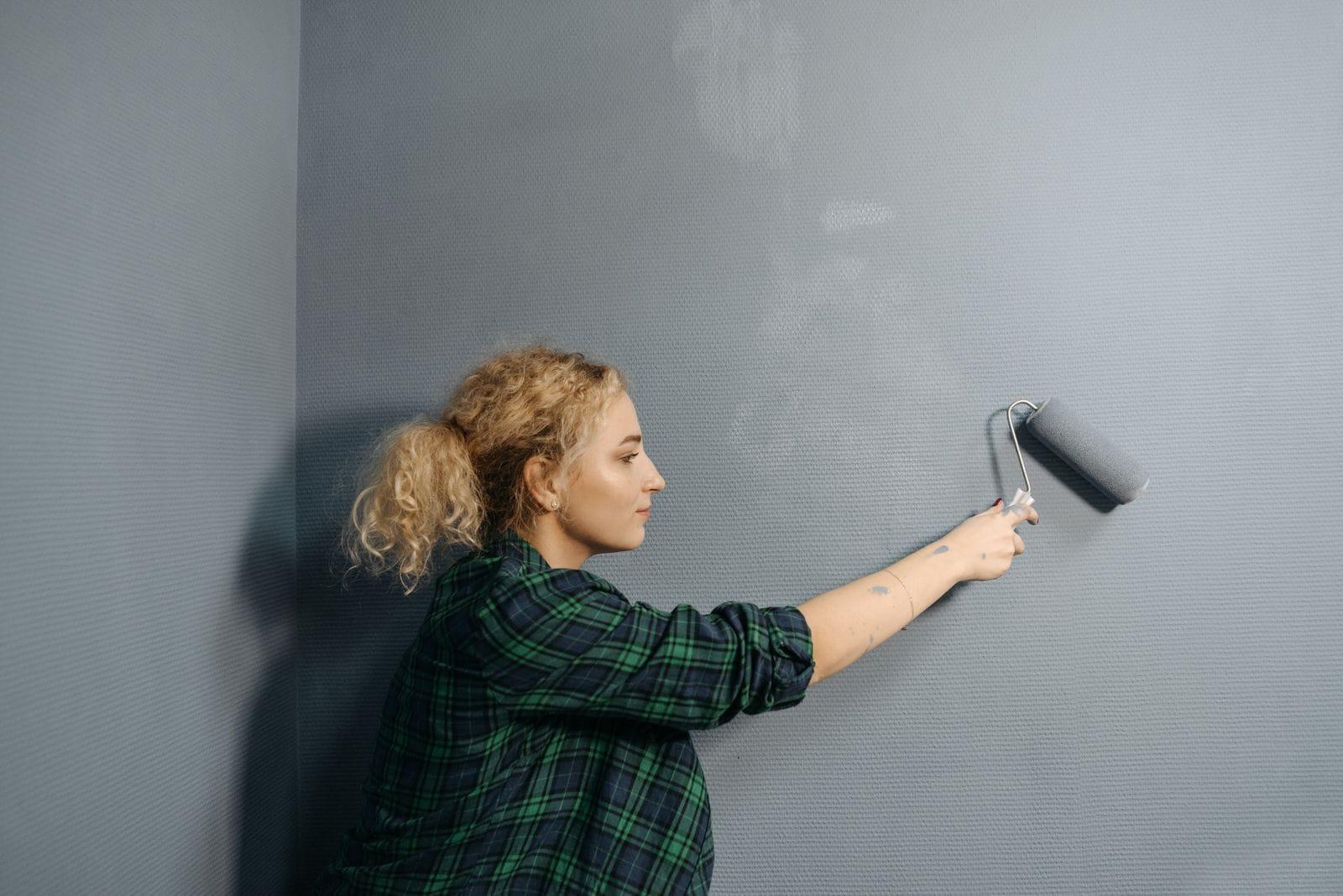 Painter finishing an interior wall