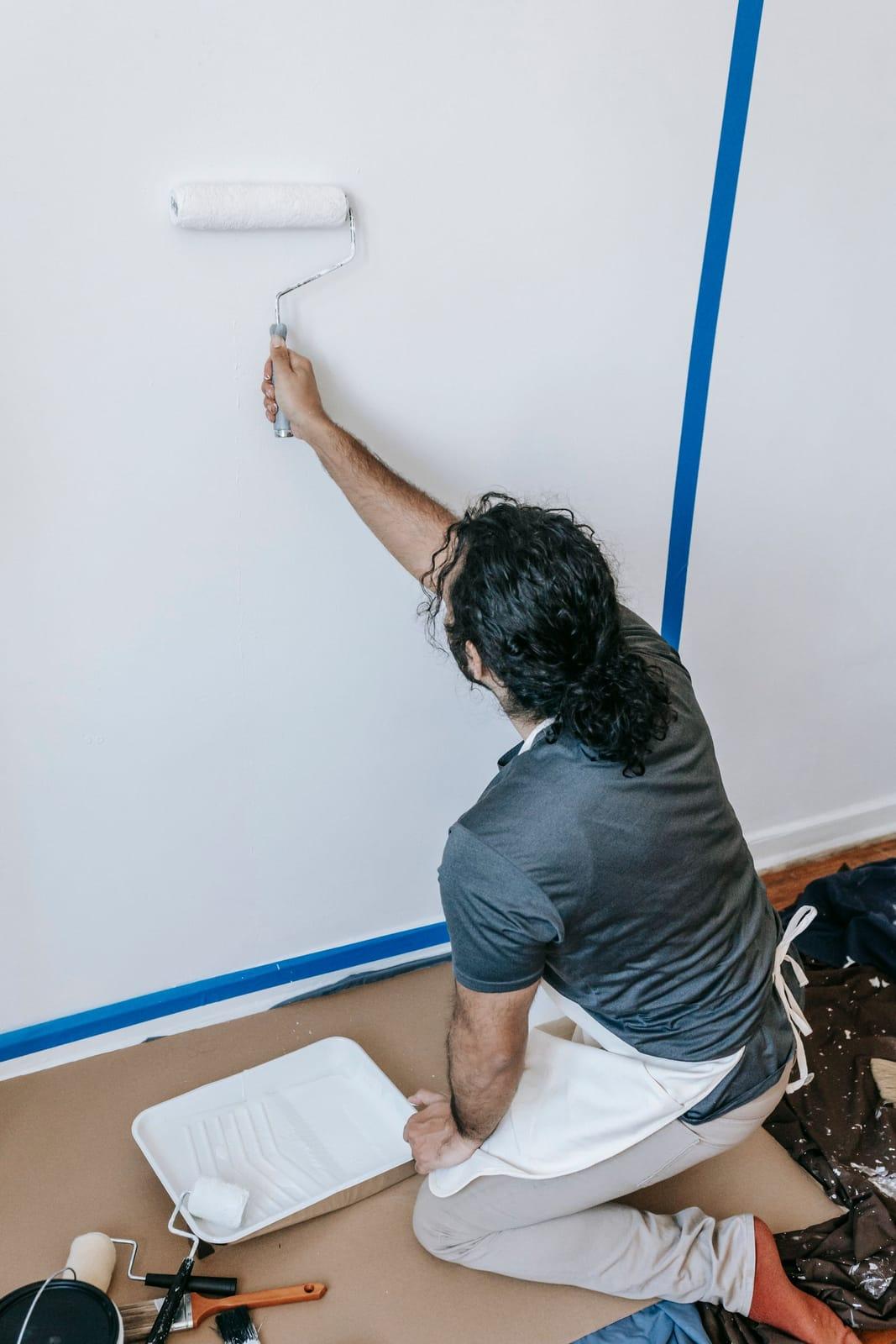 Finishing an interior wall with a paint roller